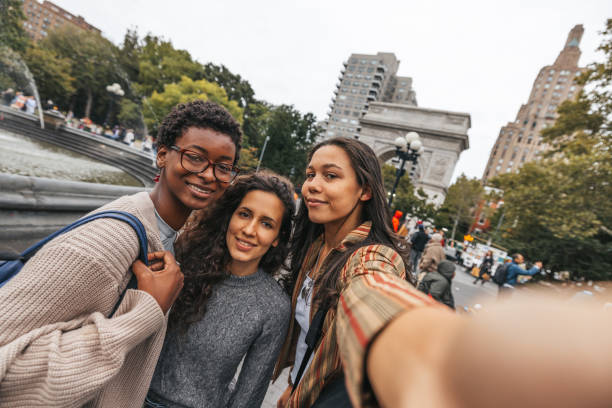 istock Three friends take a selfie in Washington Square, New York 1457991267
