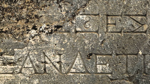 istock Ancient Greek Writing Chiselled on Stone. Wallpaper 1457991620