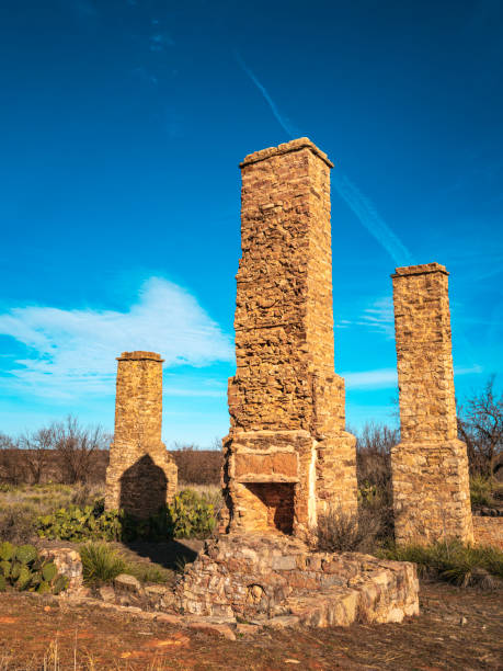 Historic Fort Phantom Hill in Abilene, Texas, three tall ruined chimneys Historic Fort Phantom Hill in Abilene, Texas, USA, three tall ruined chimneys abilene texas stock pictures, royalty-free photos & images