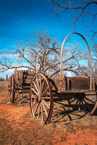 Weathered 19th century antique wagon at Historic Fort Phantom Hill in Abilene, Texas, USA
