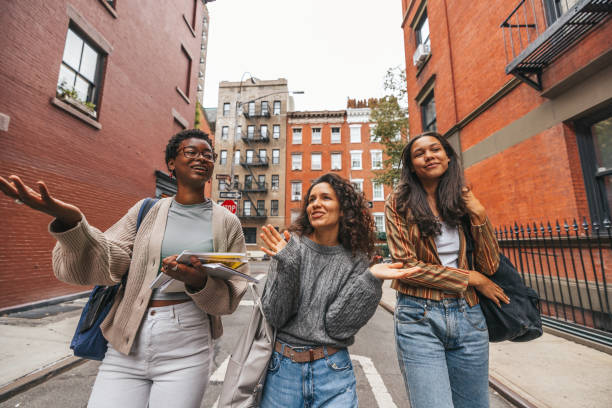istock Three friends walking in the West Village, NY 1457993257