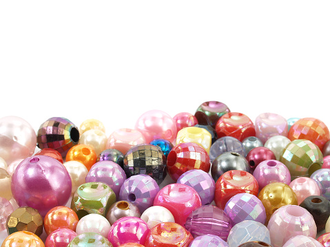 pile of accessories for crafting necklaces or bracelets, selective focus