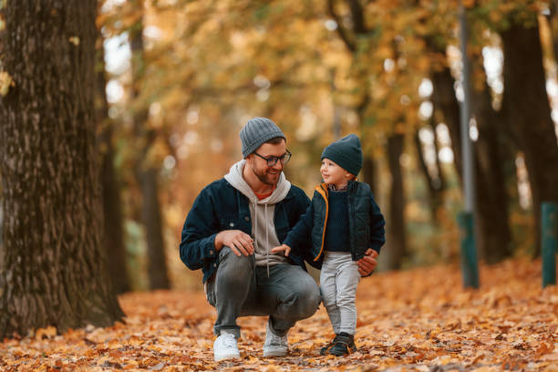 istock Adventure time. Father and young son is together outdoors at daytime 1457994598