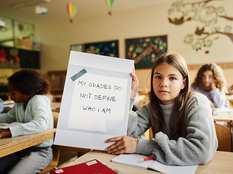 Elementary schoolgirl don't want to be judged by her grades at school.