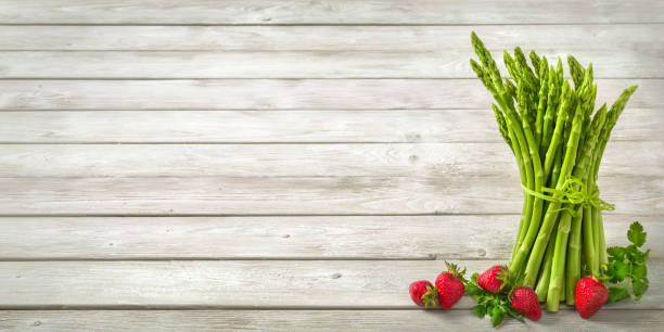 Asparagus on wood background