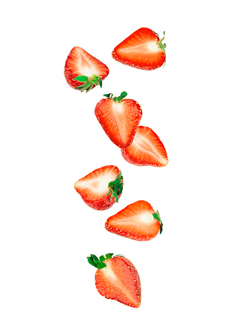 Falling of strawberry slices isolated on white background.