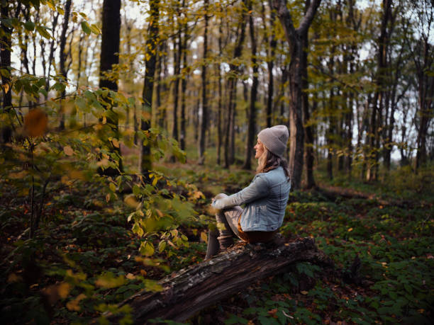 istock Smiling woman resting in autumn day. 1457998874