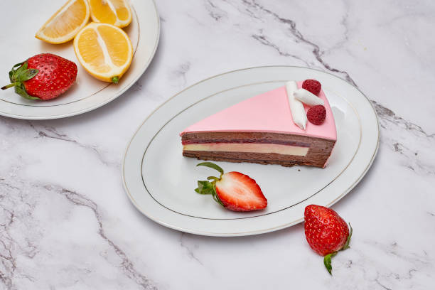 istock a slice of layered cake on a plate with strawberries 1457999251