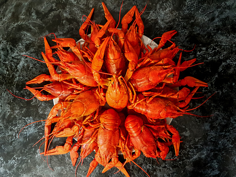 A large portion of boiled crayfish on a plate. High quality photo