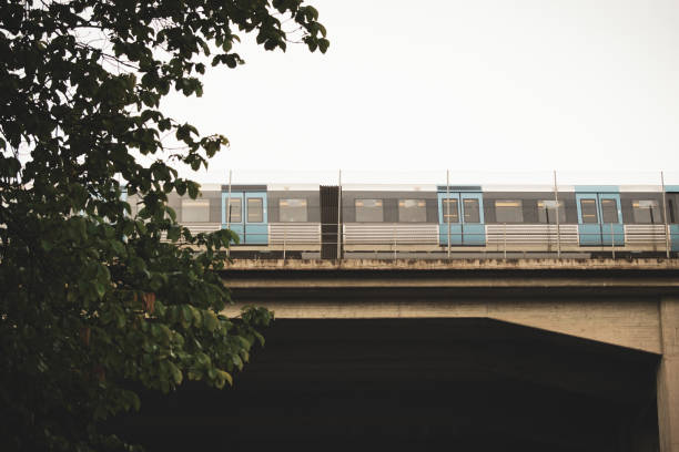 istock Low angle view of train on railroad bridge against sky 1457999468