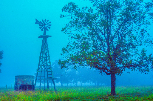 Rural farm Texas windmill scenic ranch landscape.