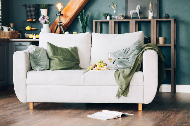 istock Fruits and wine on sofa at home 1458003612