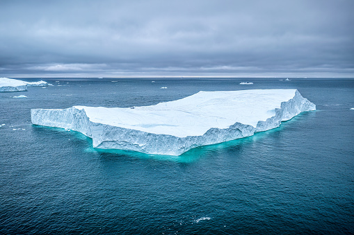 aerial view of icebergs floating in the arctic sea, Greenland