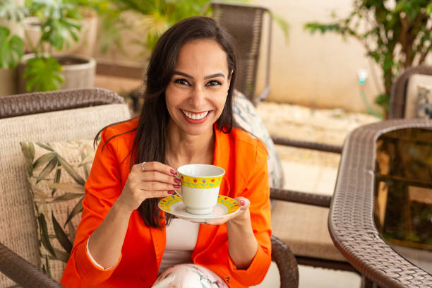 istock A young woman, drinking tea. 1458003702