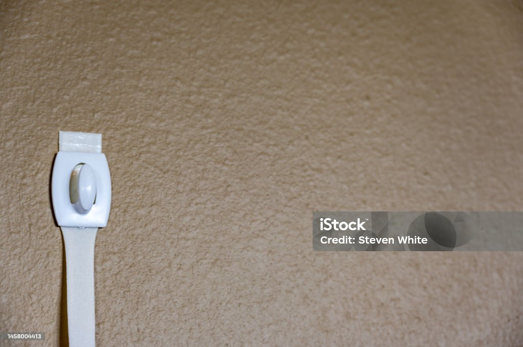 Selective Focus On Adhesive Strip Wall Hanger That Can Be Removed By  Pulling Tape Stock Photo - Download Image Now - iStock