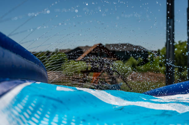 istock Selective focus on jets of droplets shooting out across a water slide 1458004487