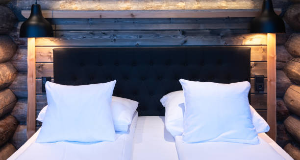 istock Double bed with pillows in hotel room. Interior design concept. 1458006275