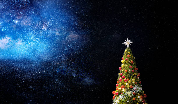 istock Shiny Christmas tree and stars of universe 1458009062