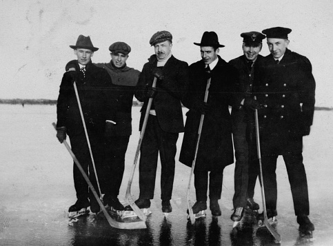 Kingston, Ontario, Canada - 1916. Group of men playing ice hockey on Lake Ontario at Kingston, Canada.