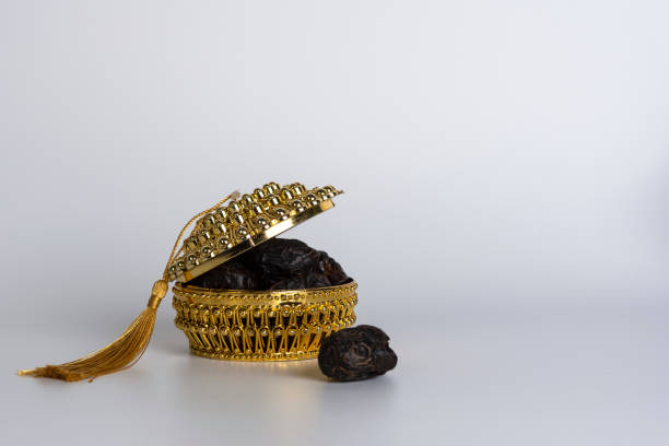 istock a basket of dates with a gold umbrella 1458014094