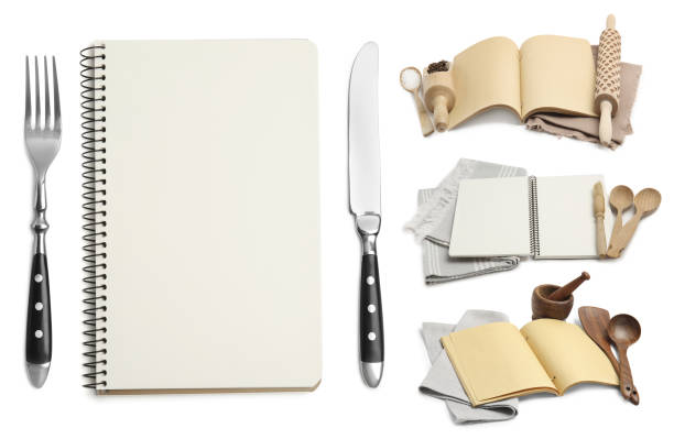Set with blank recipe books and kitchen utensils on white background