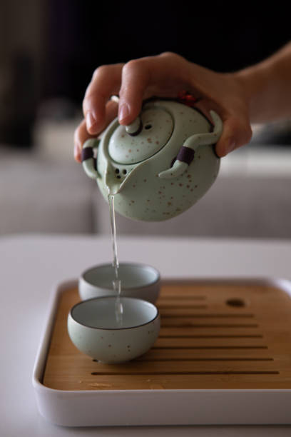 istock Asian tea set on bamboo mat,Closeup. 1458016832