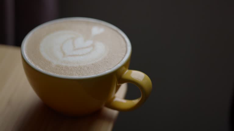 Cup of Coffee With Latte Art On Table