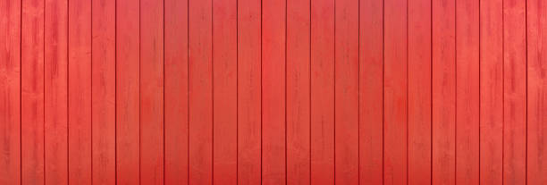 Red painted panoramic wooden wall made of vertical boards