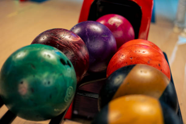 istock Colorful bowling balls stand in a row 1458025645