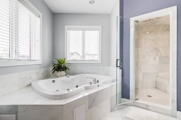 istock A bathroom's large bathtub and walk-in shower. 1458026723
