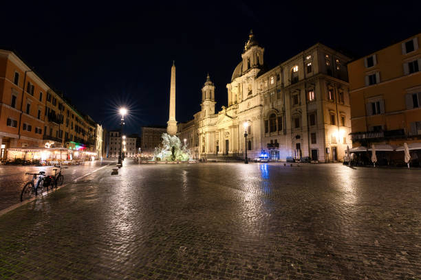 istock Piazza Navona in Rome at night with police 1458027202