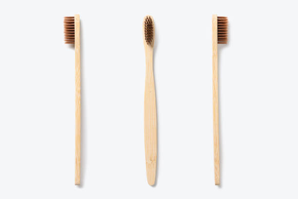 istock Wooden toothbrush on a light background. Eco friendly toothbrush. 1458027335
