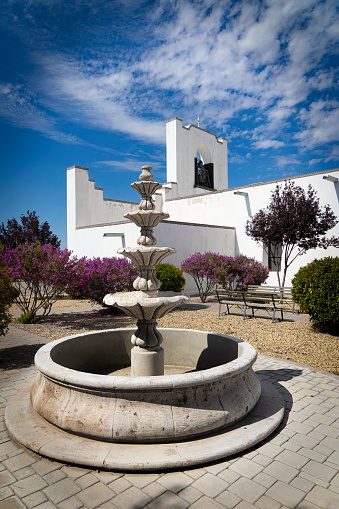 A dry fountain next to the Socorro Mission on the El Paso Mission Trail in Socorro, Texas.
