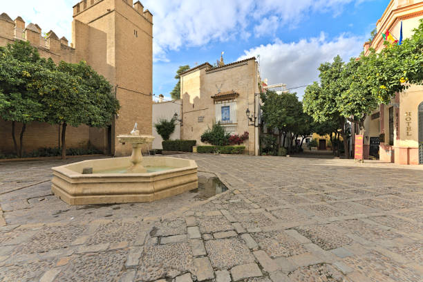 Fountain of the Plaza de la Alianza Fountain of the Plaza de la Alianza on a sunny day without pedestrians. santa cruz seville stock pictures, royalty-free photos & images