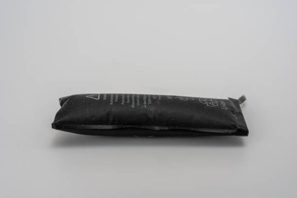 istock A swollen faulty smartphone battery on a light background. 1458035763