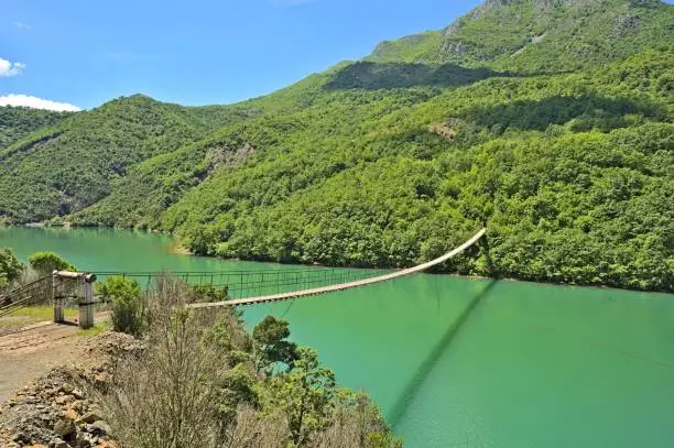 Shkopet lake with a mysterious bridge over the river leading to actually just some sheep tracks