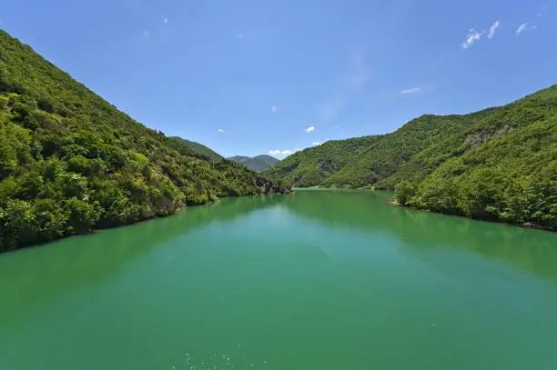 Shkopet lake with wonderful emerald green water on a sunny day