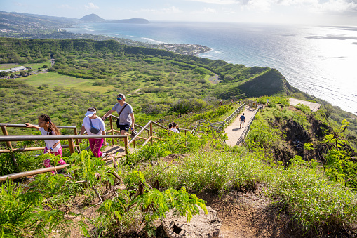 Honolulu, Hawaii - December 27, 2022:  Tourists hiking on the Diamond Head lookout trail.