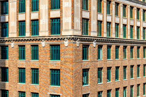 Full frame view of the corner of an historic brick building located in downtown Houston, Texas.