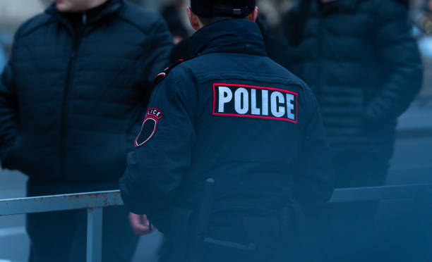 istock Policeman standing in the city 1458046589