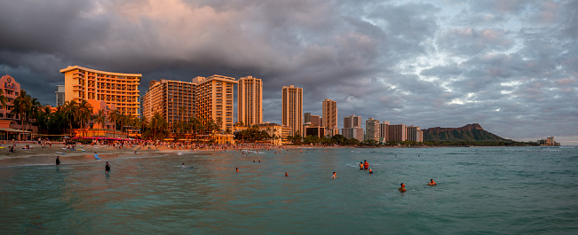 Honolulu, Hawaii - December 29, 2022: View of Waikiki Beach with Diamond Head valcano in the distance.