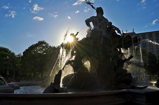 istock Neptune Fountain Berlin Alexanderplatz with background sun 1458049864