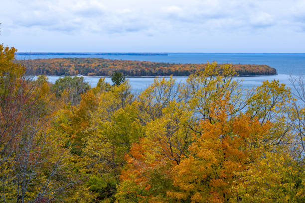 Beautiful fall colors explode at small lake in the Hiawatha National Forest in the Upper Peninsula of Michigan.