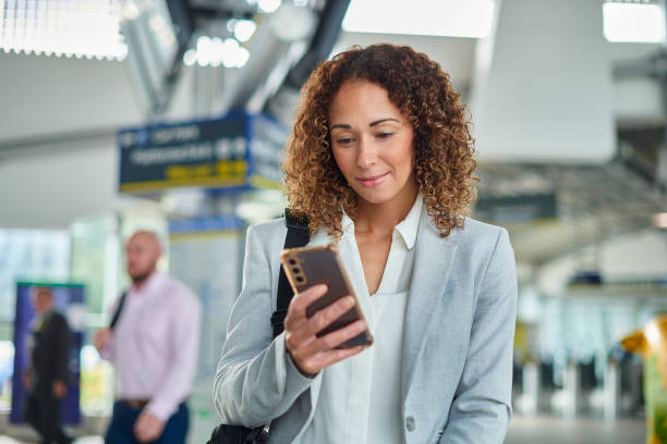 istock business traveller checking her messages 1458054630