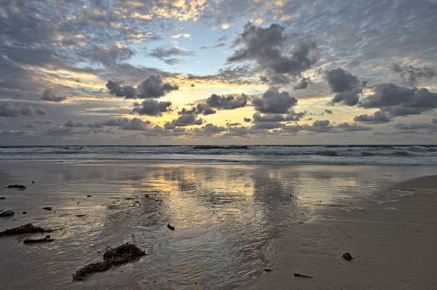 istock Sunrise at Frazer Islands with a cloudy sky 1458055556