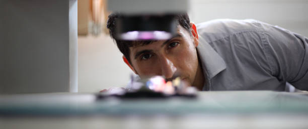 istock He designed precision in Mechanical Engineering.Close-up Shot of the Industrial Engineer 1458056658