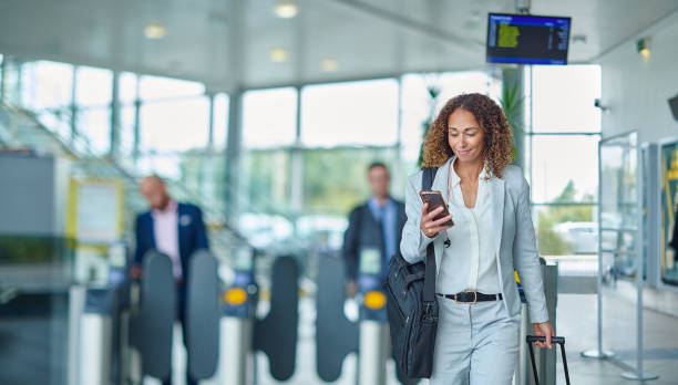 istock business traveller checking her messages on arrival 1458058554