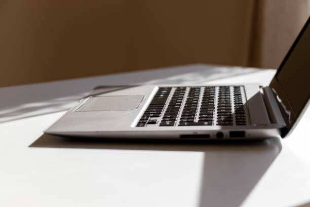 istock Side view of laptop on desk 1458074069