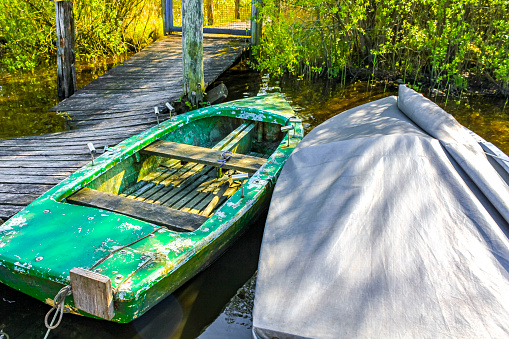 Old boats and broken jetty in Germany.