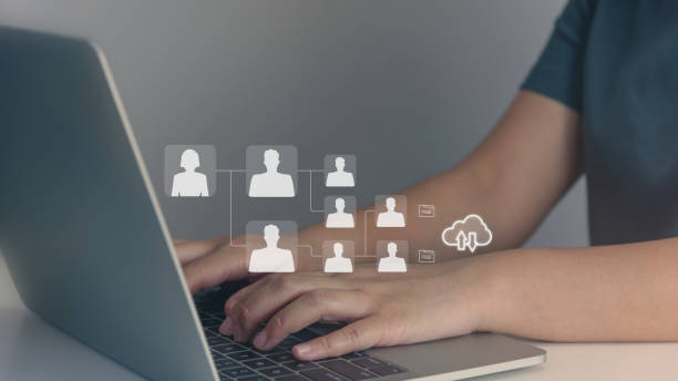 istock Person using laptop and network interface and glowing human resource for planning long-term, using database on cloud. 1458076415